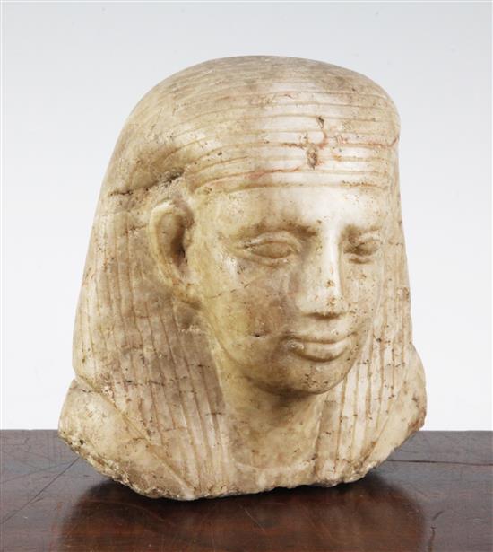 An Egyptian quartzite bust of a man, late period (26th dynasty), possibly a priest, height 17cm